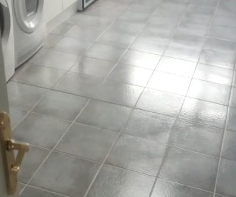 clean grey tiles and grout in a kitchen